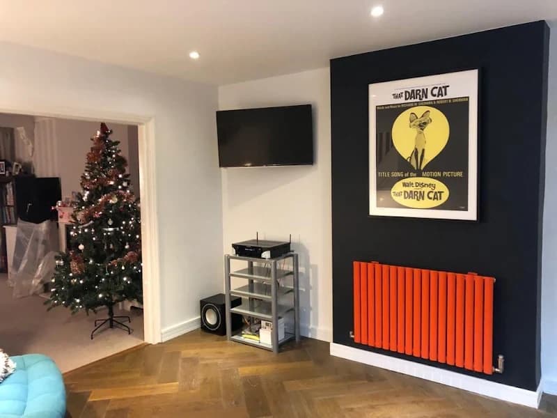 Commercial bar interior with bespoke shelving and feature radiator