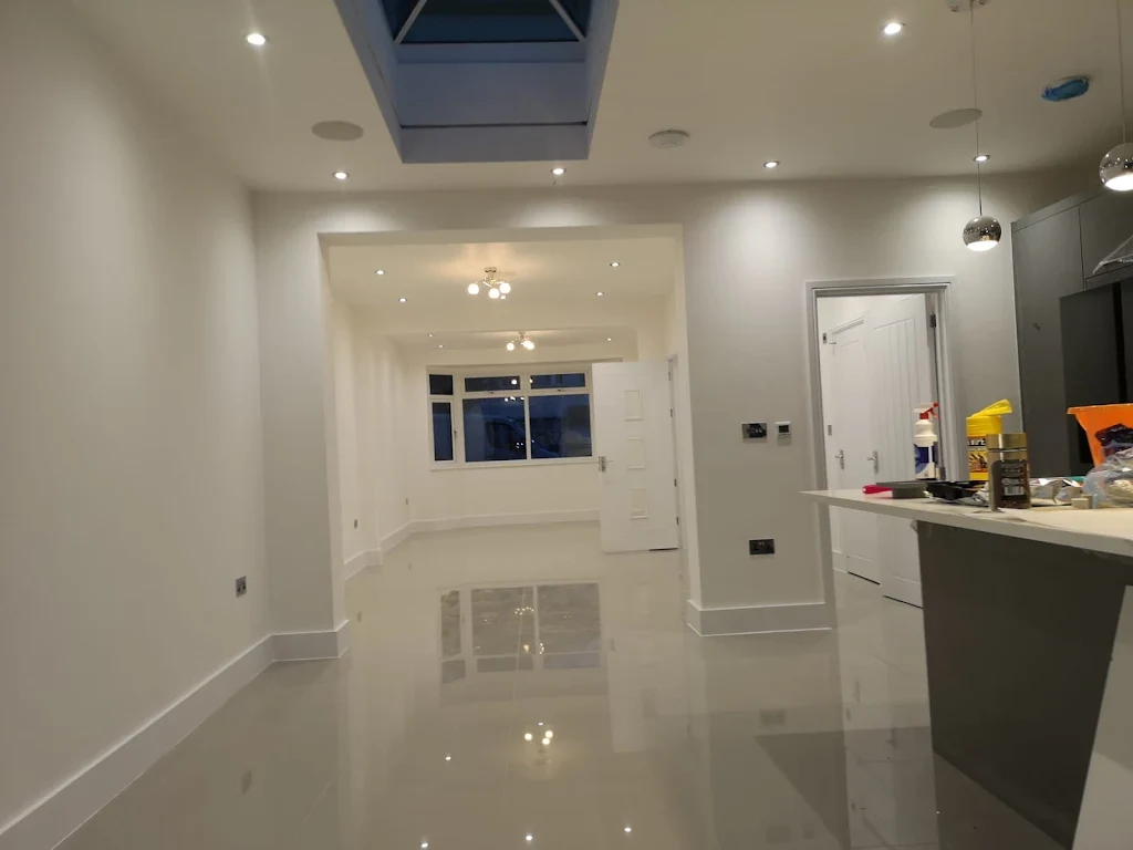 Crisp white kitchen units with clean finish and tiled backsplash