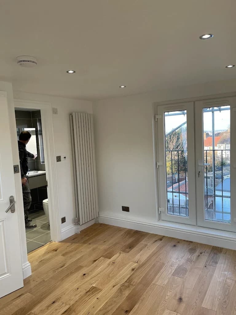 Completed loft room with skylight and wood floor